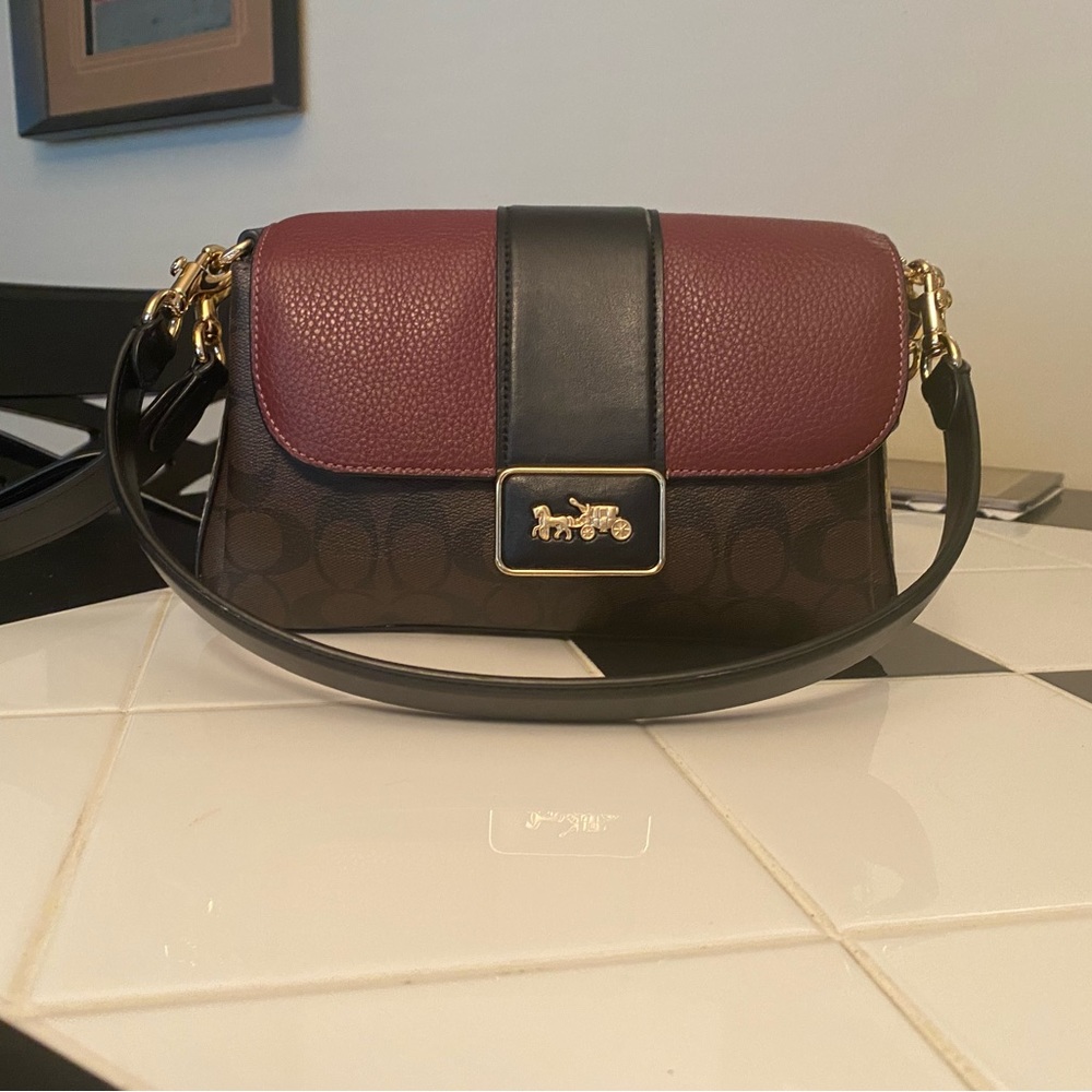 Like new Coach handbag. Beautiful unique style.